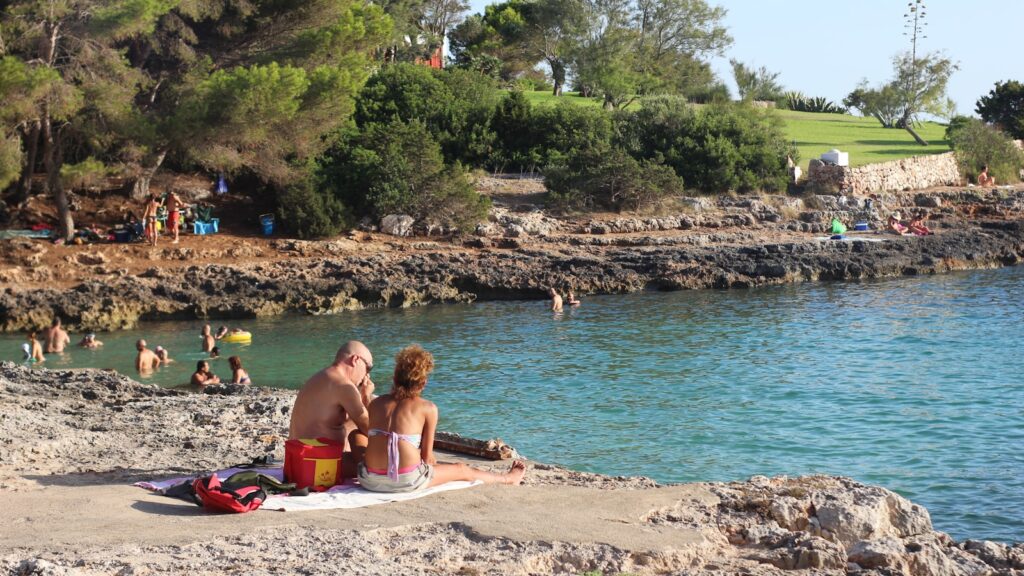 Family enjoying holidays on a sunny beach in Spain