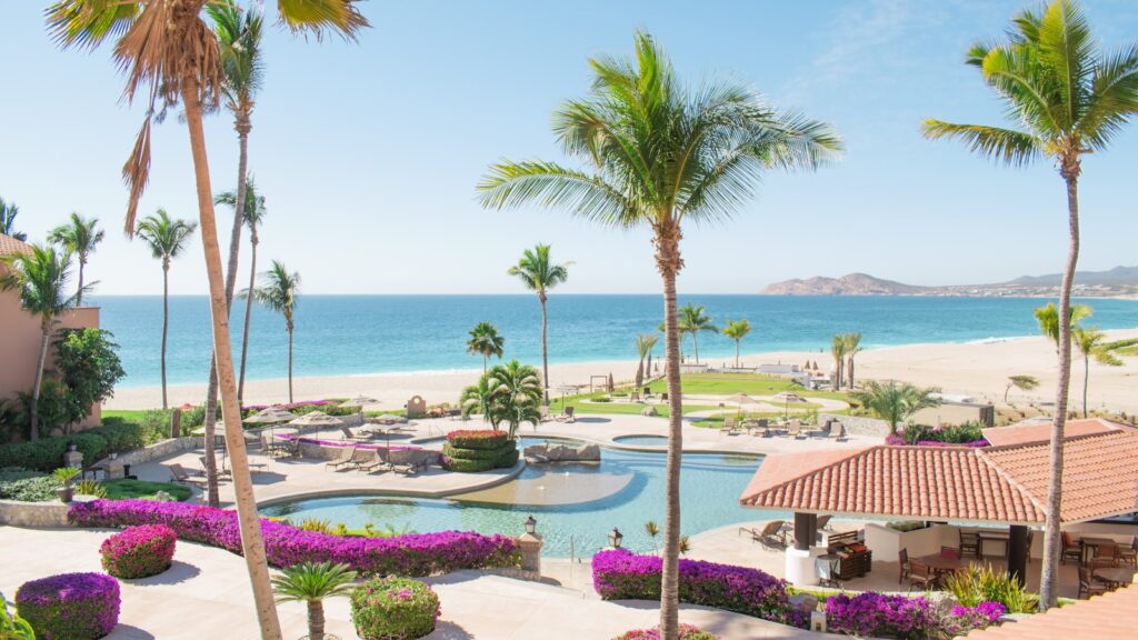 All-inclusive resort on the coast of Mexico with palm trees and blue sea